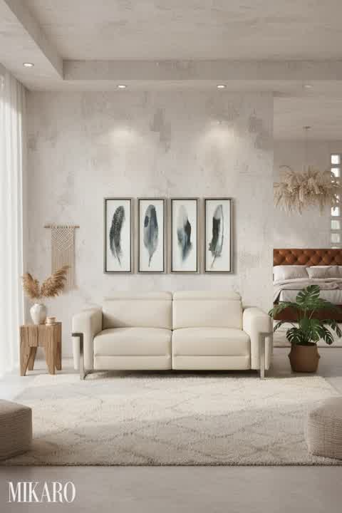 Bohemian Chic Living: Italian Leather Sofa & Feathered Art in a Serene Setting