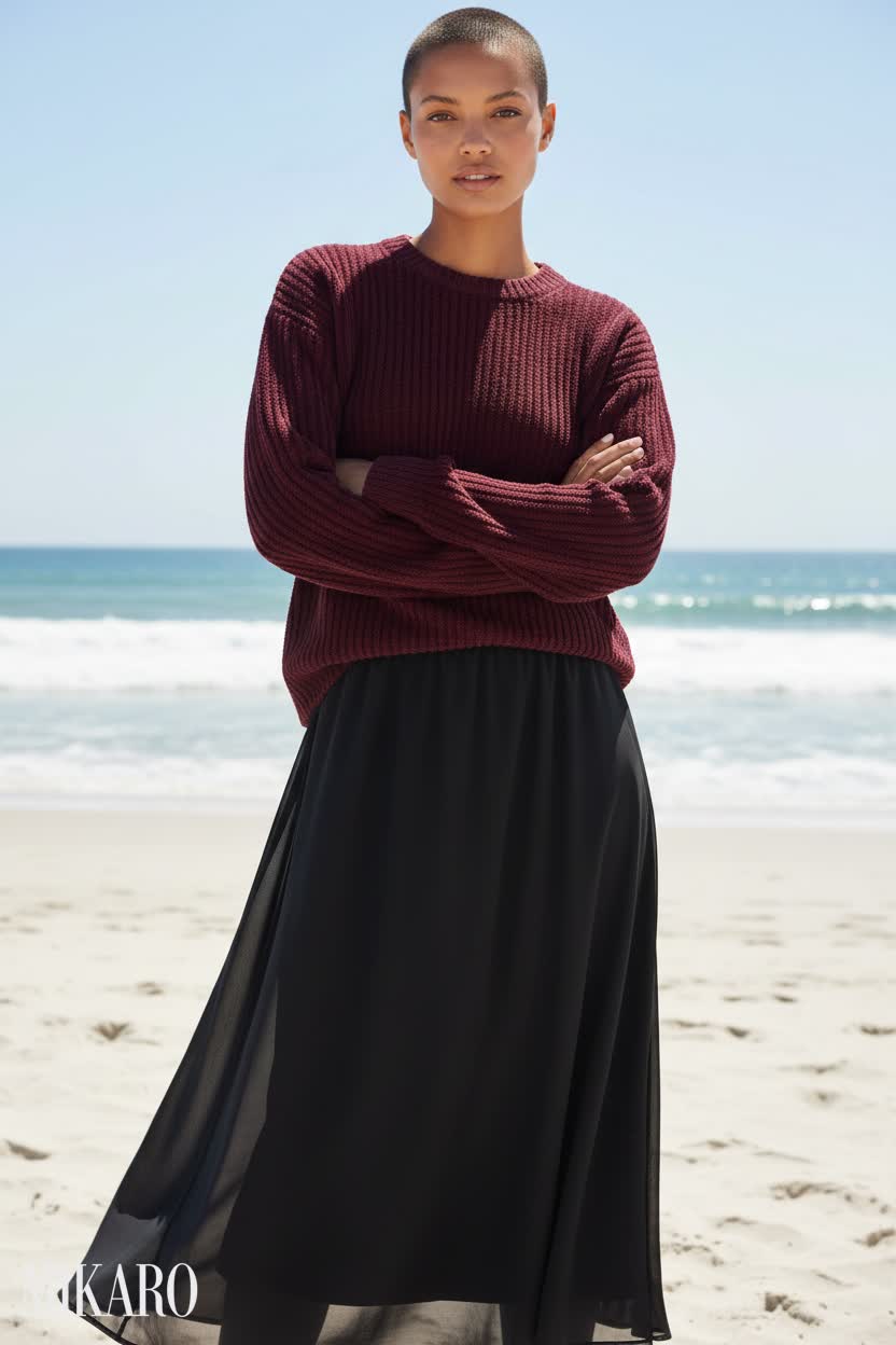 Confident Beach Style: Burgundy Sweater & Flowing Black Skirt